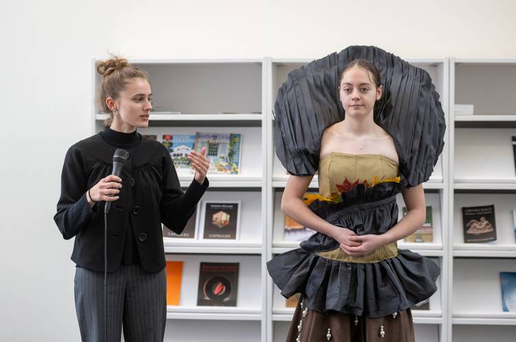 A KSY School of Fashion student models another student's avian biomimicry design.